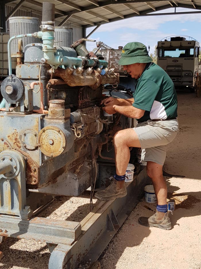 Volunteer John fixing Machinary at Winton Truck & Machinery Museum